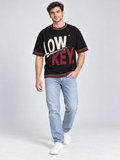 Low Key High Standard oversized cotton T-shirt — campaign on-model digital styling illustration with denim