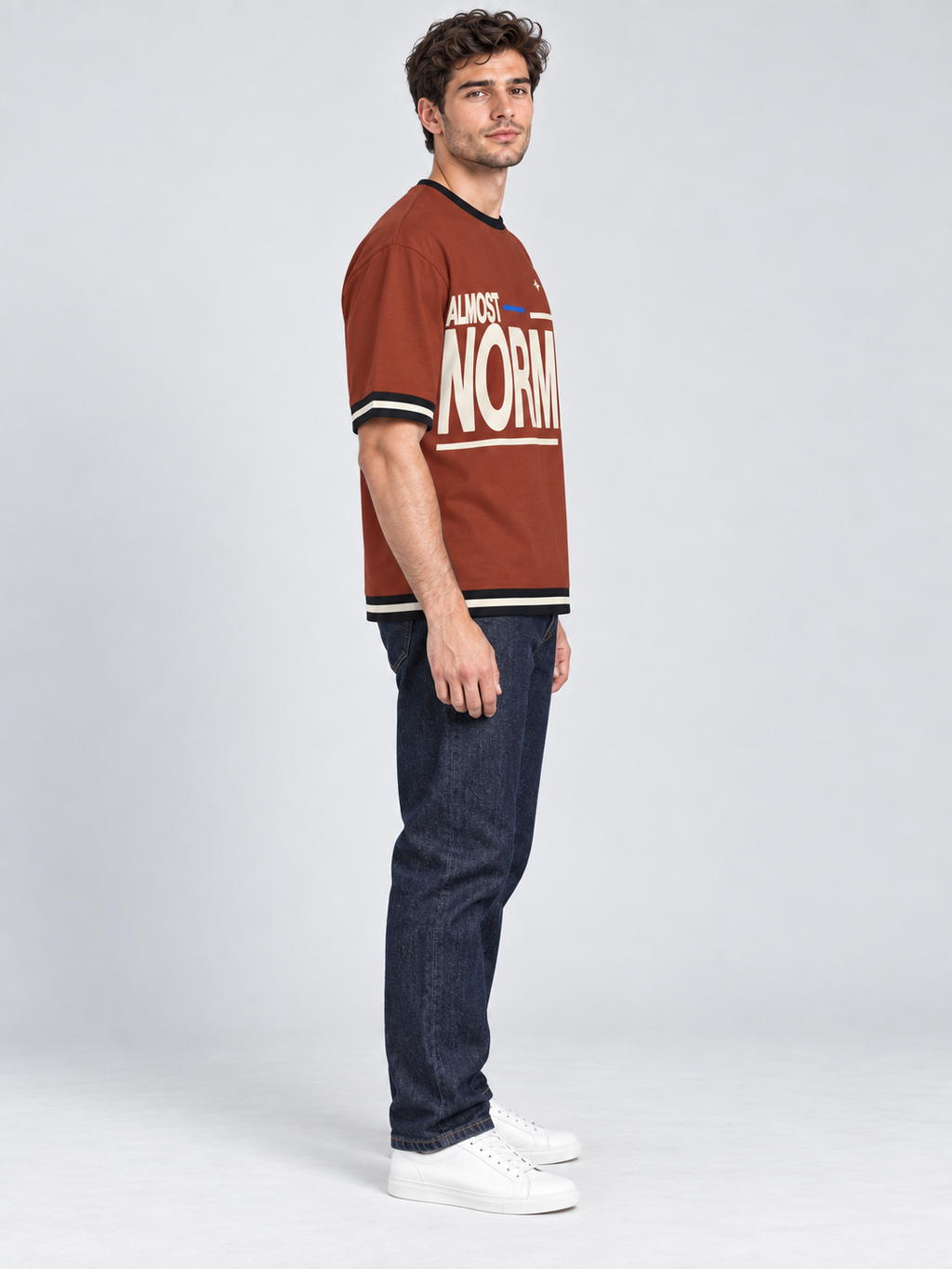 Almost Normal oversized cotton T-shirt — side on-model digital styling illustration with denim