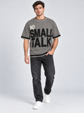 No Small Talk oversized cotton T-shirt — campaign on-model digital styling illustration with denim