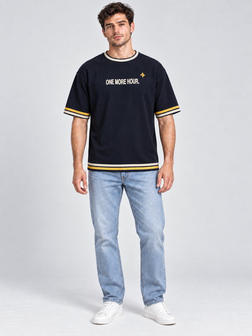 One More Hour oversized cotton T-shirt — front on-model digital styling illustration with denim