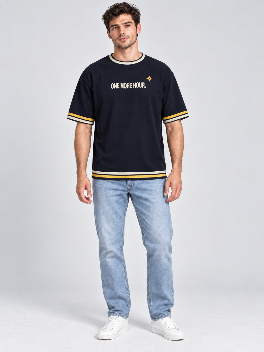 One More Hour oversized cotton T-shirt — front on-model digital styling illustration with denim