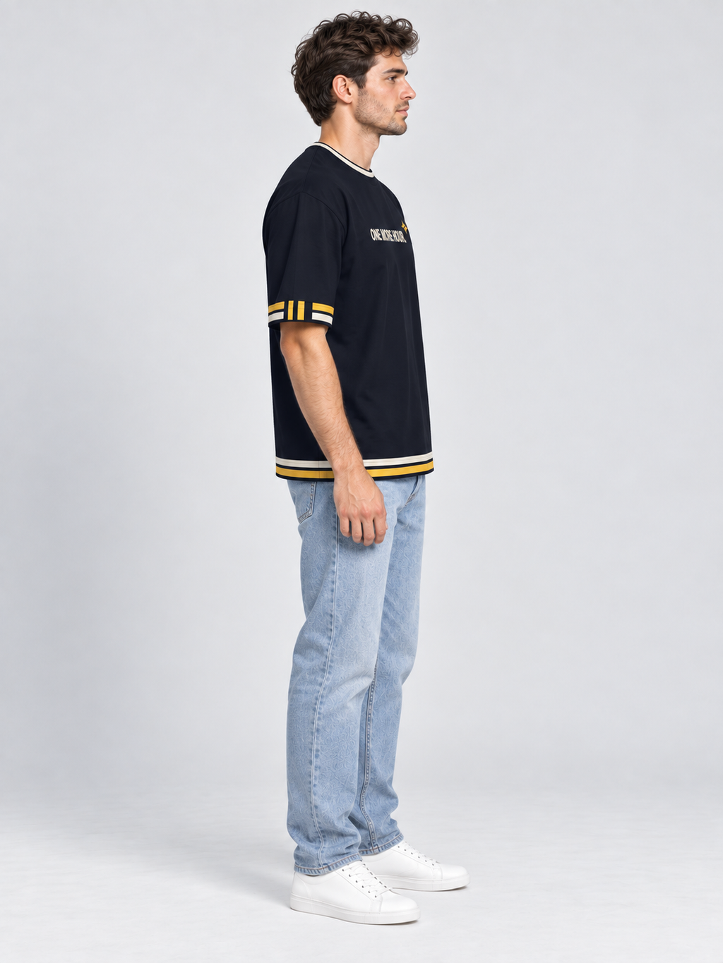 One More Hour oversized cotton T-shirt — side on-model digital styling illustration with denim