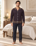 Adult model wearing the Aubergine Mosaic Luxury Pajama Set in a bright bedroom — AI styling illustration