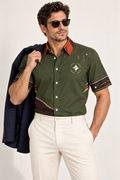 UNIKCOSA Olive Ember Terrace cotton satin shirt, editorial model view — AI styling illustration