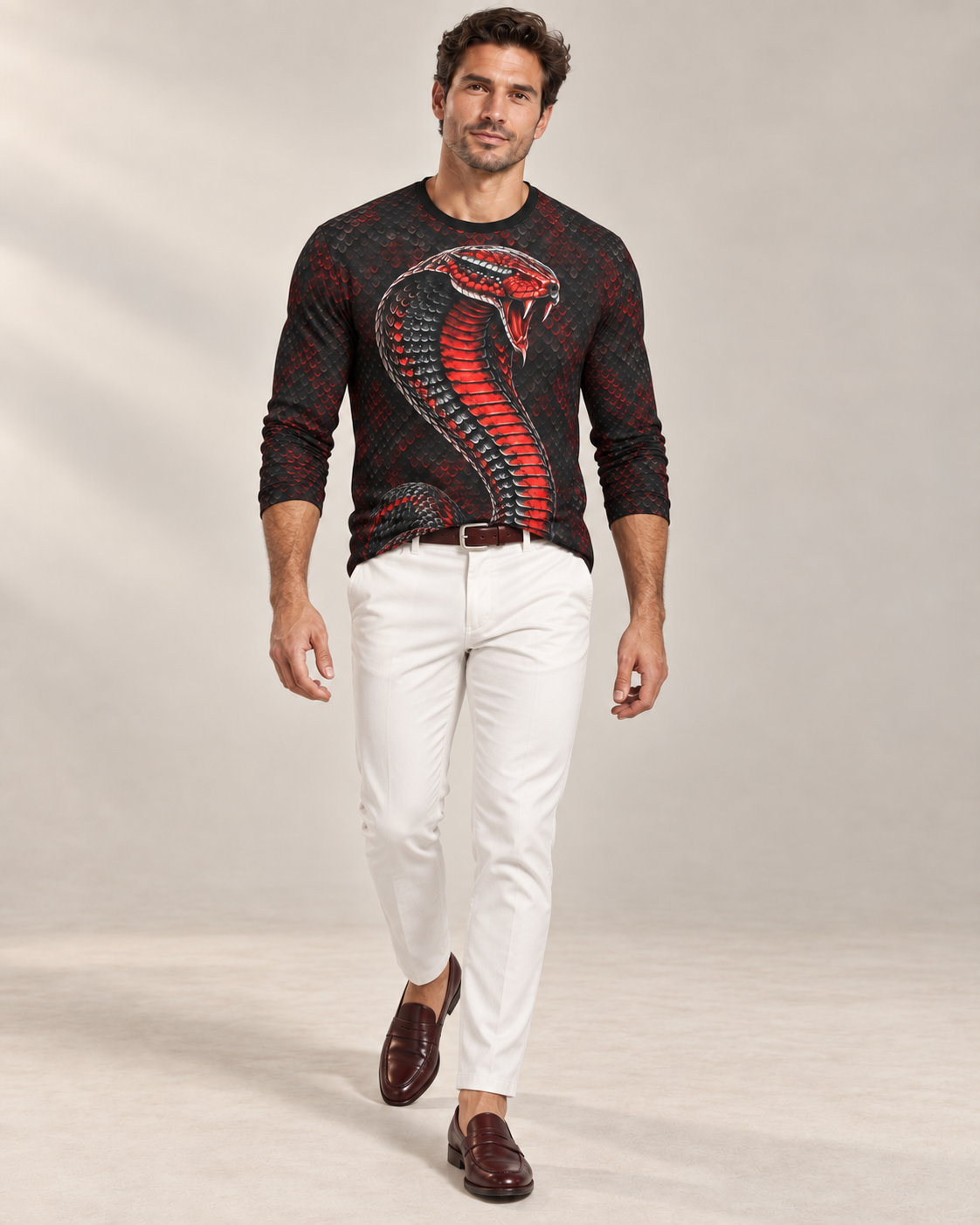 Cobra Elite Luxury Long Sleeve T-Shirt by UNIKCOSA, front walking view with white tailored trousers and cherry-brown loafers — AI-generated model illustration