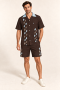 Cocoa Glacier cotton satin shirt and shorts set, front model view. AI-generated styling illustration.