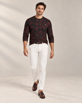 Crimson Frame Luxury Long Sleeve T-Shirt by UNIKCOSA, front walking view with white tailored trousers and cherry-brown loafers — AI-generated model illustration