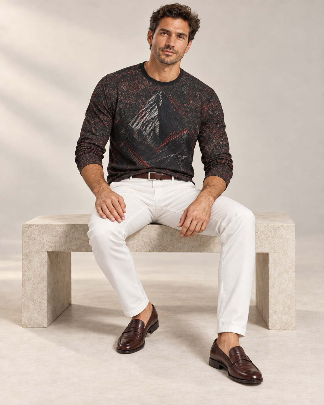 Crimson Ridge Luxury Long Sleeve T-Shirt by UNIKCOSA, seated view with white tailored trousers and cherry-brown loafers — AI-generated model illustration