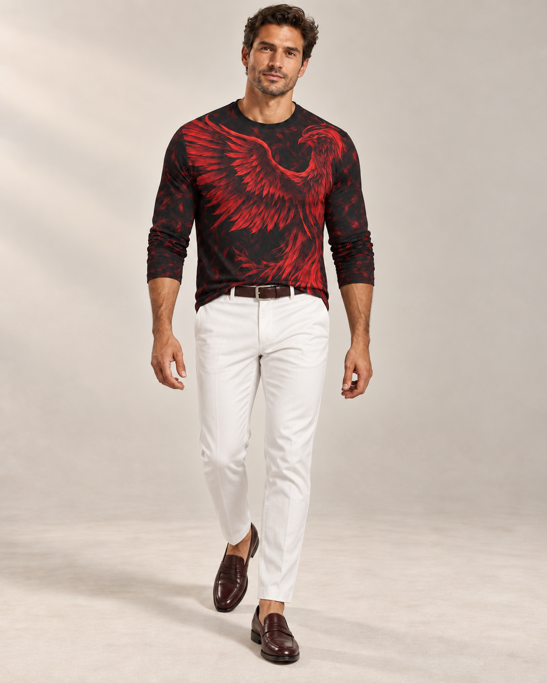 Fire Phoenix Luxury Long Sleeve T-Shirt by UNIKCOSA, front walking view with white tailored trousers and cherry-brown loafers — AI-generated model illustration