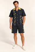 Graphite Citrine cotton satin shirt and shorts set, front model view. AI-generated styling illustration.