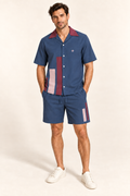 Indigo Rosewood cotton satin shirt and shorts set, front model view. AI-generated styling illustration.