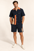 Ink Papaya cotton satin shirt and shorts set, front model view. AI-generated styling illustration.