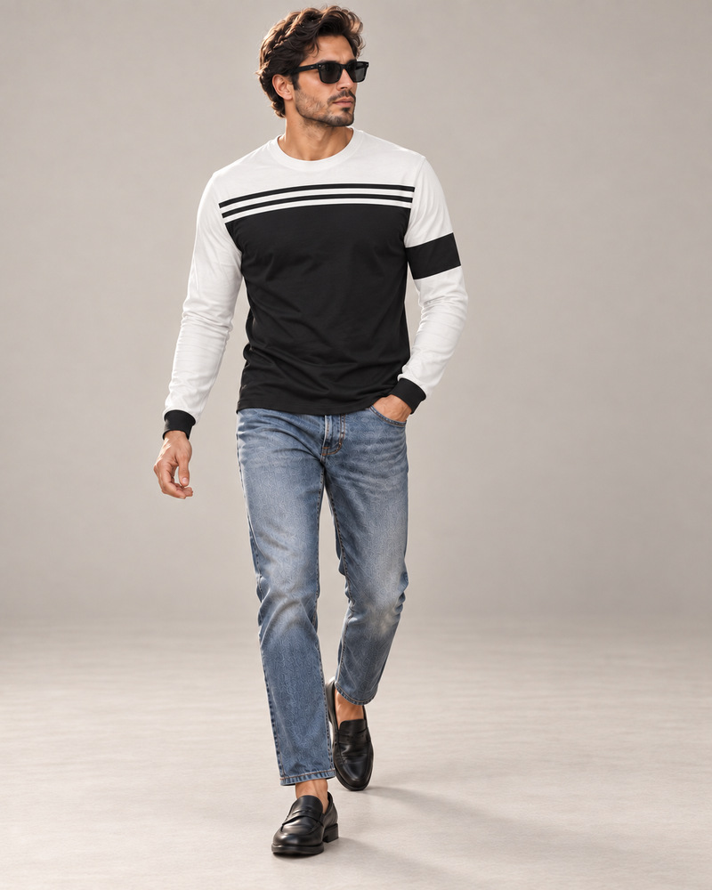 Monochrome Line Luxury Bounce Cotton Long Sleeve T-Shirt by UNIKCOSA, walking in a plain indoor studio with straight jeans and black loafers — AI styling visual