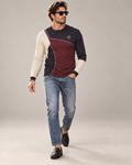 Oxblood Plum Luxury Bounce Cotton Long Sleeve T-Shirt by UNIKCOSA, walking in a plain indoor studio with straight jeans and black loafers — AI styling visual