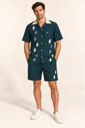 Petrol Oyster cotton satin shirt and shorts set, front model view. AI-generated styling illustration.