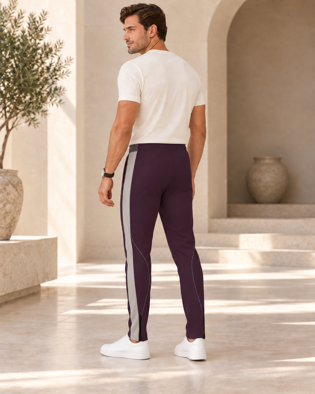 Plum Silver Luxury Rox Jersey Track Pants by UNIKCOSA — rear three-quarter model styling view