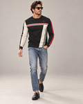 Racing Spirit Luxury Bounce Cotton Long Sleeve T-Shirt by UNIKCOSA, walking in a plain indoor studio with straight jeans and black loafers — AI styling visual