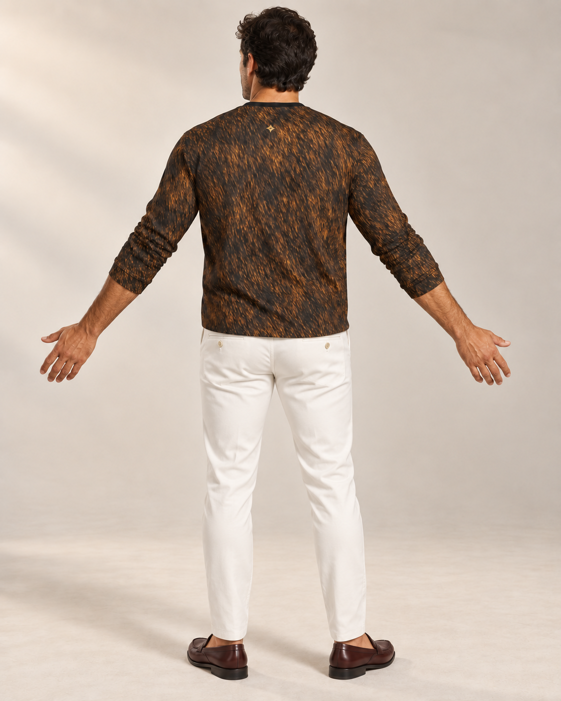 Royal Amber Luxury Long Sleeve T-Shirt by UNIKCOSA, rear with arms extended view with white tailored trousers and cherry-brown loafers — AI-generated model illustration
