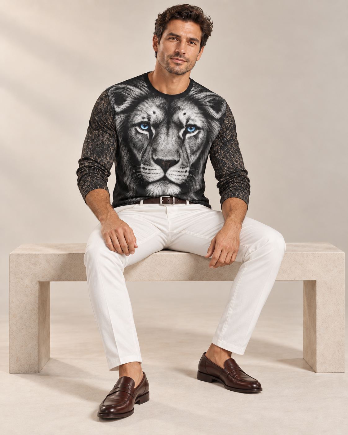 Silver Lion Luxury Long Sleeve T-Shirt by UNIKCOSA, seated view with white tailored trousers and cherry-brown loafers — AI-generated model illustration