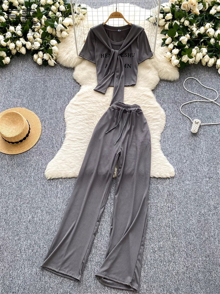 UNIKCOSA’s 3-Piece Streetwear Set — Letter Print Tee + Elastic Pants + Solid Shawl