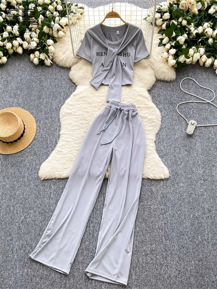 UNIKCOSA’s 3-Piece Streetwear Set — Letter Print Tee + Elastic Pants + Solid Shawl