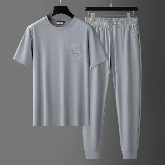 UNIKCOSA Men’s Solid Color Summer Set – Loose Fit Breathable Two-Piece Sportswear (Short Sleeve & Shorts, Plus Sizes Available)