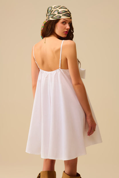 White poplin mini dress with a big bow detail