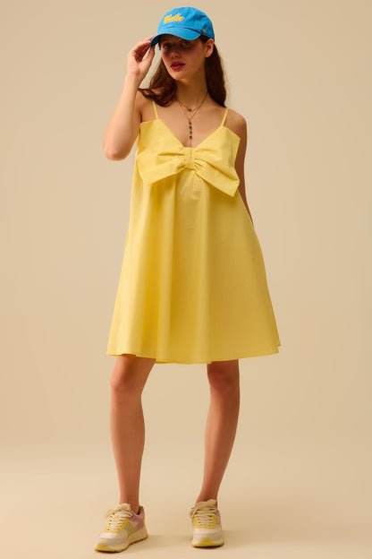 Yellow poplin mini dress with a big bow detail