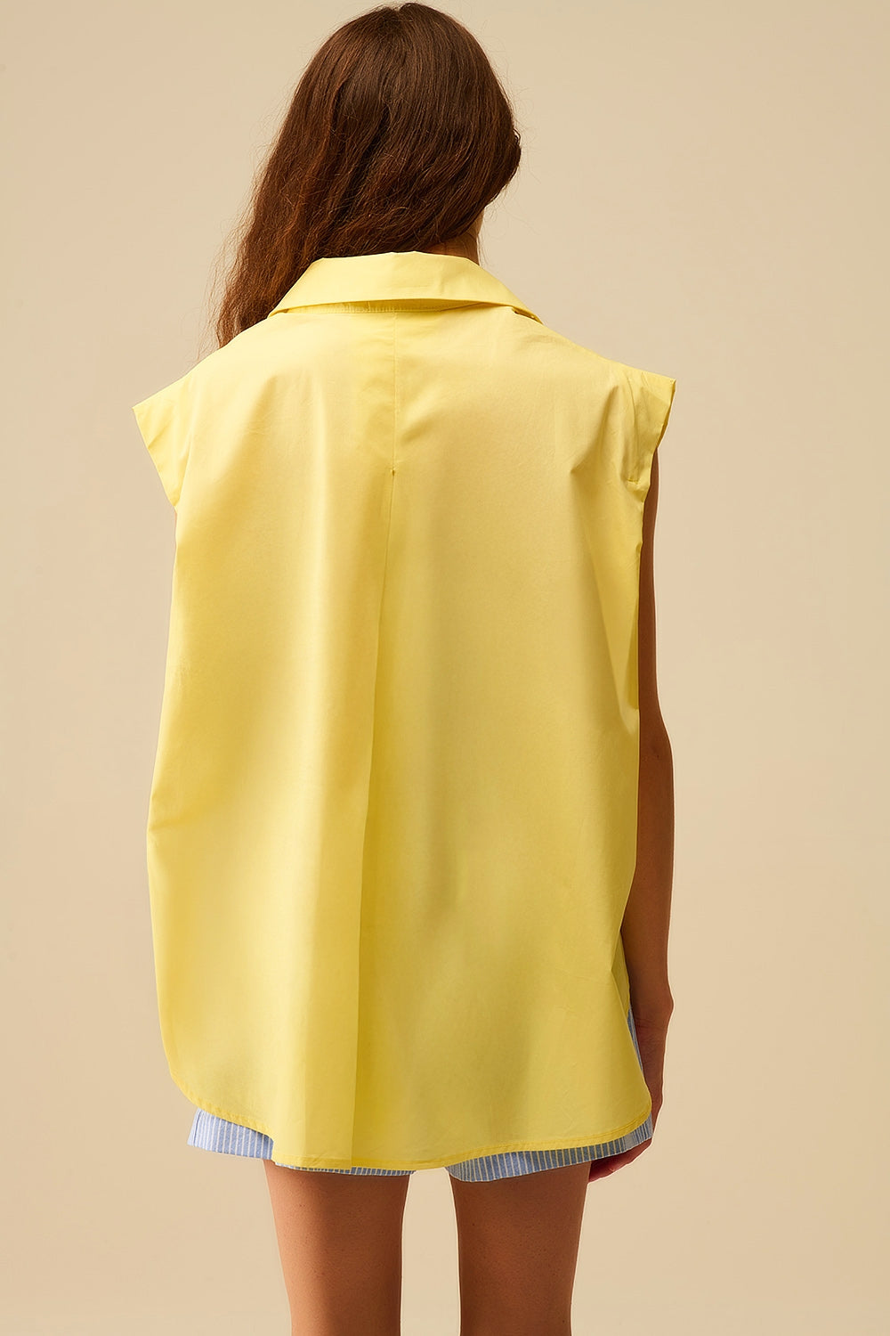 Yellow Sleeveless Blouse with Heart-shaped Buttons